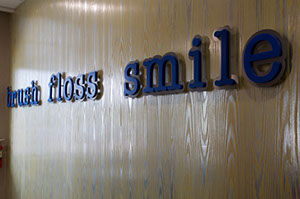 photo of words on our wall "brush floss smile"
